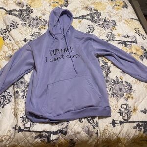 lavender hoodie that says , “fun fact: i don’t care”